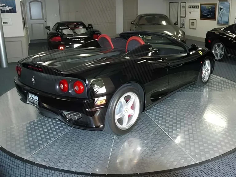 Car positioned on a motorized turntable for easy 360-degree rotation